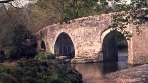 View of stone arched bridge at National Trust Lanhydrock.