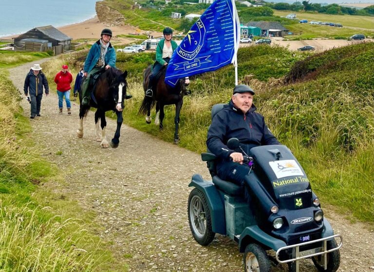 Nevil by Tramper transports the NCI flag. Horse riders follow along the spectacular coastal path