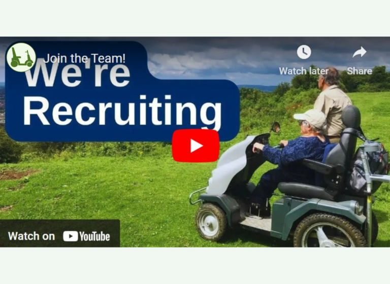 A Tramper is driven on a grassy path as two people admire the view. The words We're recruiting and watch on YouTube