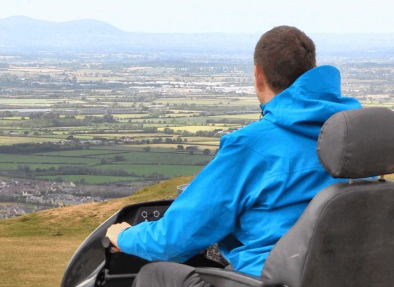 Man on Tramper overlooking vast views